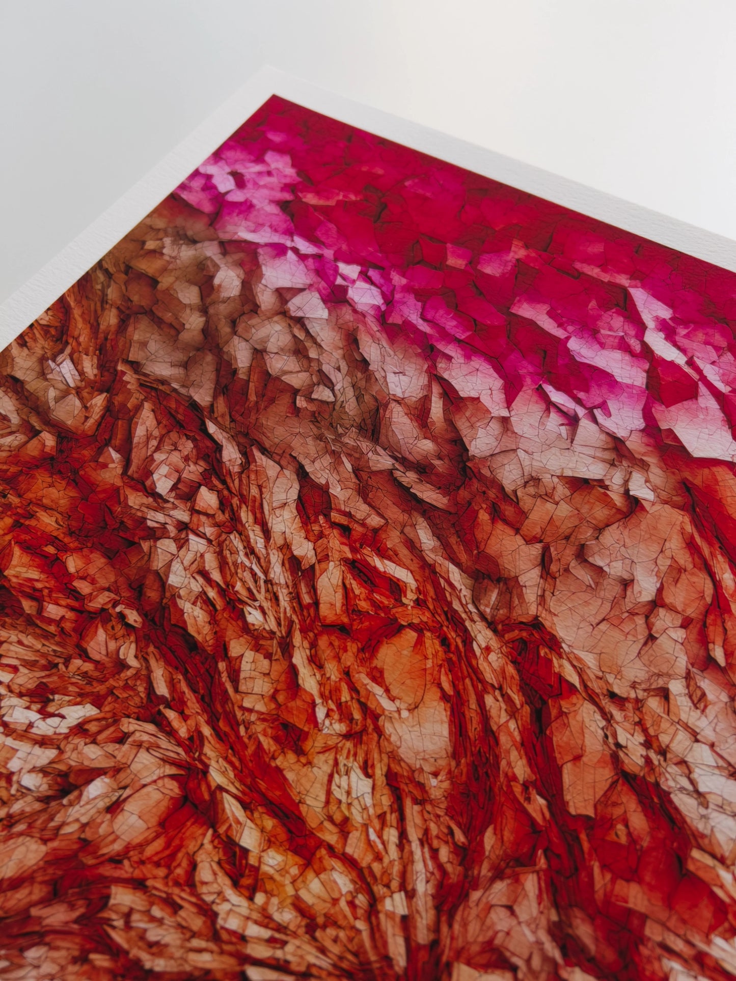 A close up artwork detail of a pink, brown, orange and red rmineral-like formation in a state of flux.